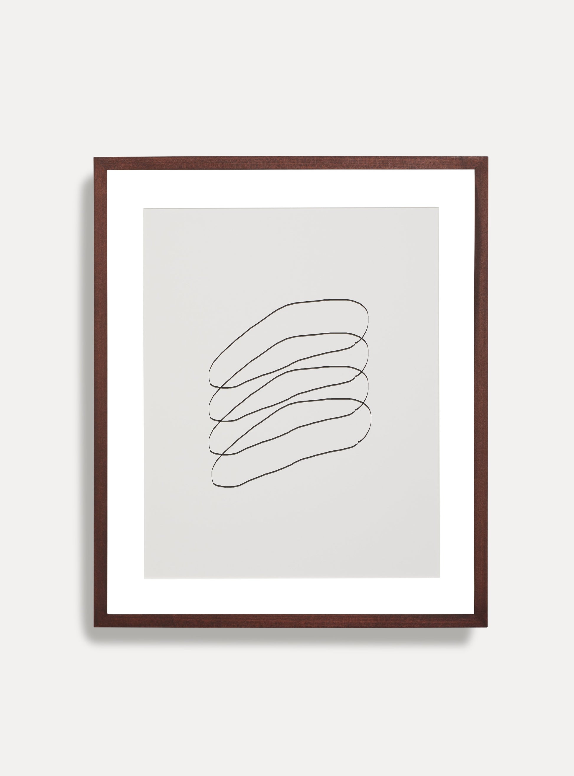 Front facing image of wooden picture frame on a white wall