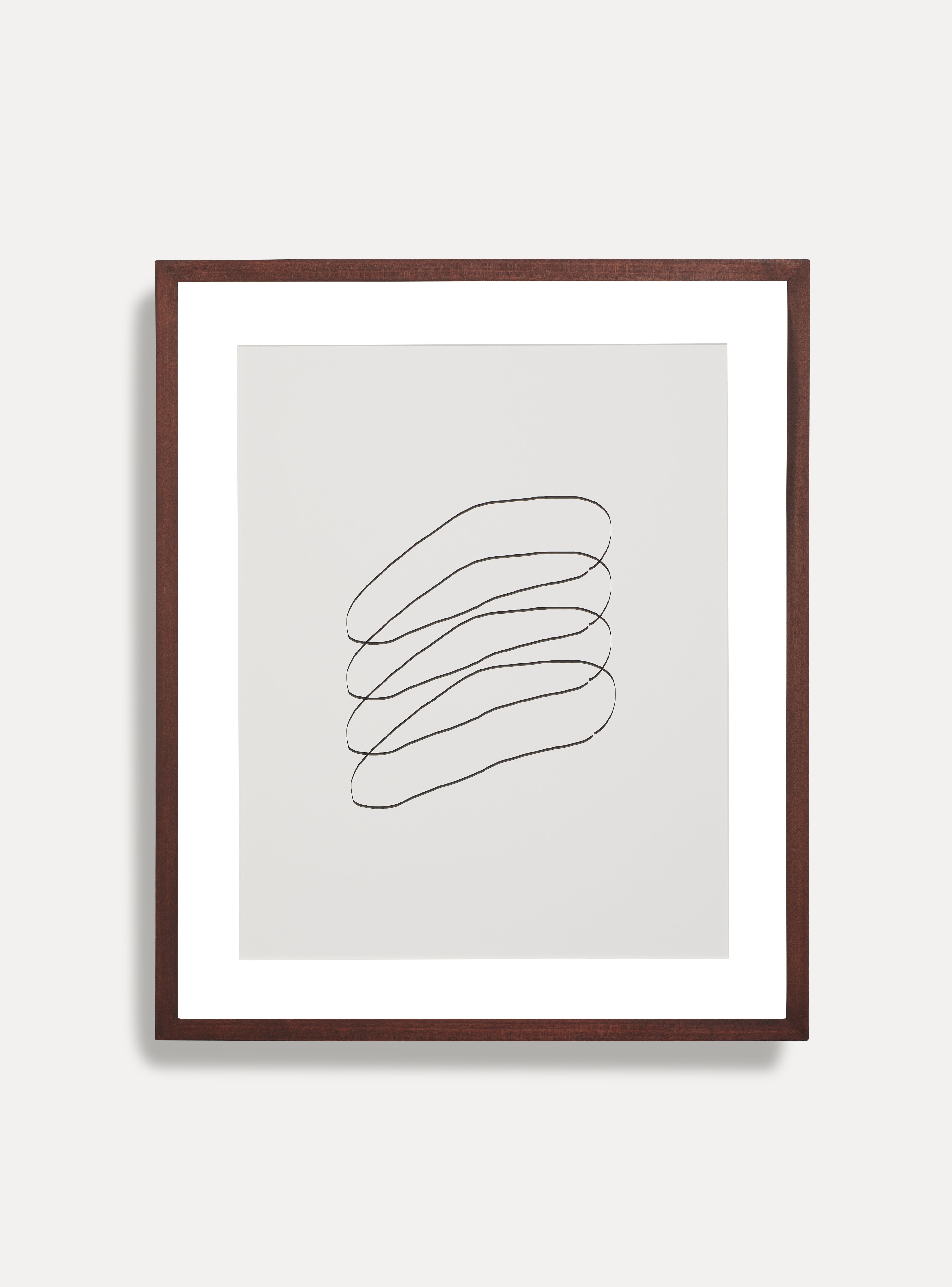 Front facing image of wooden picture frame on a white wall