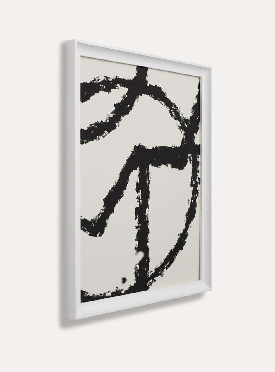 side view of white frame holding abstract art