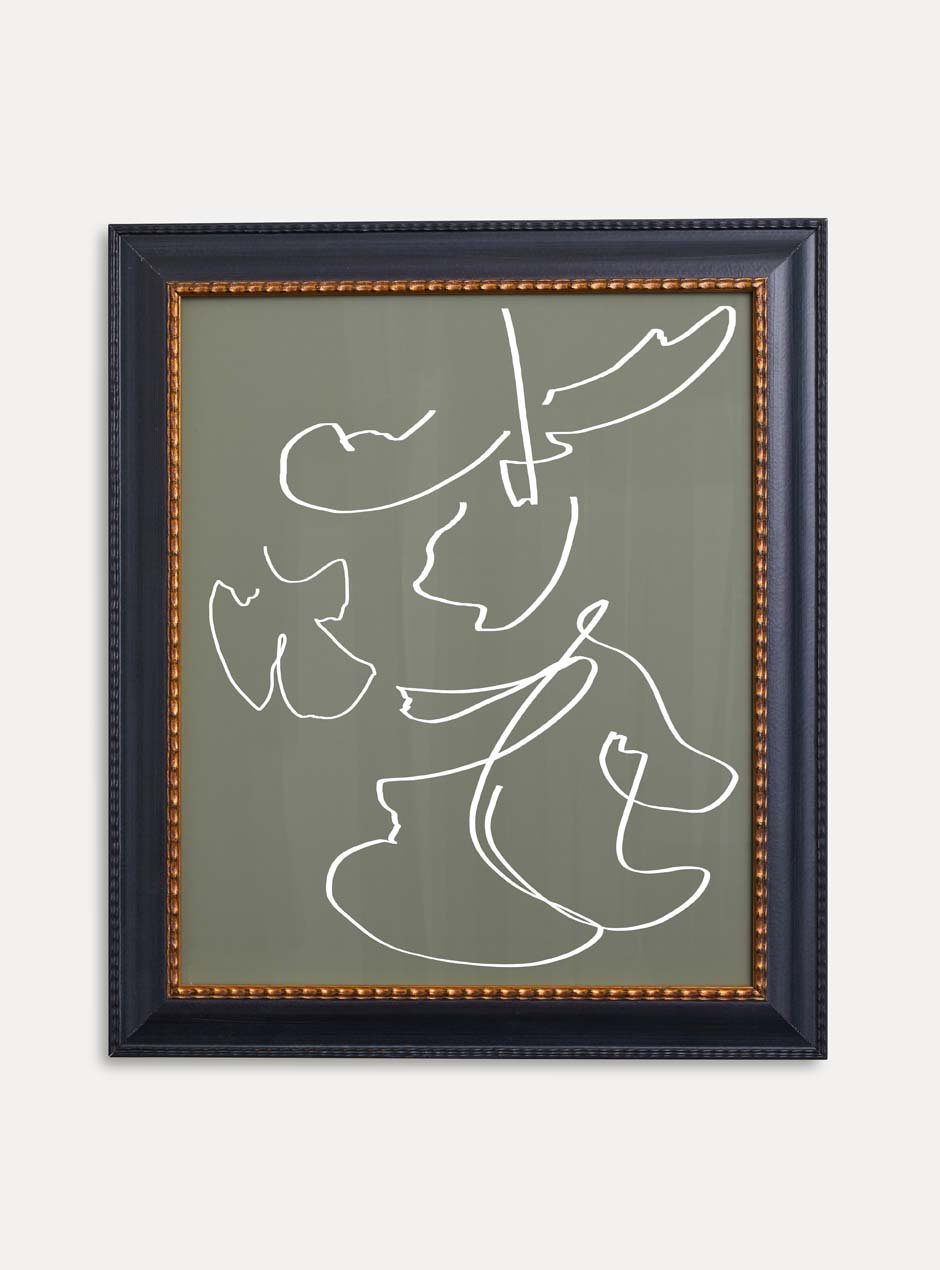 black frame with gold inner detailing holding abstract art