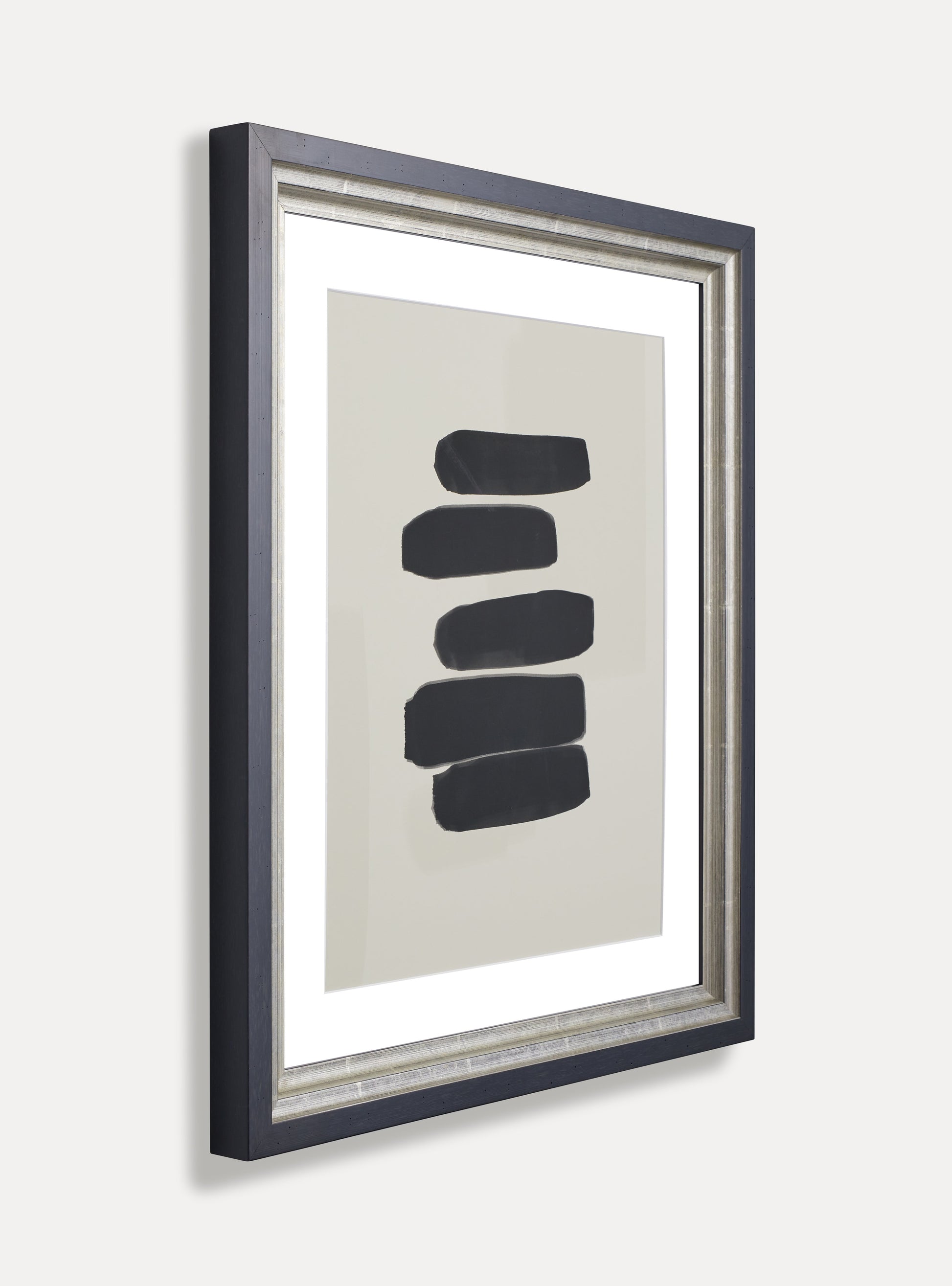 Side photo of a picture frame on an off-white wall