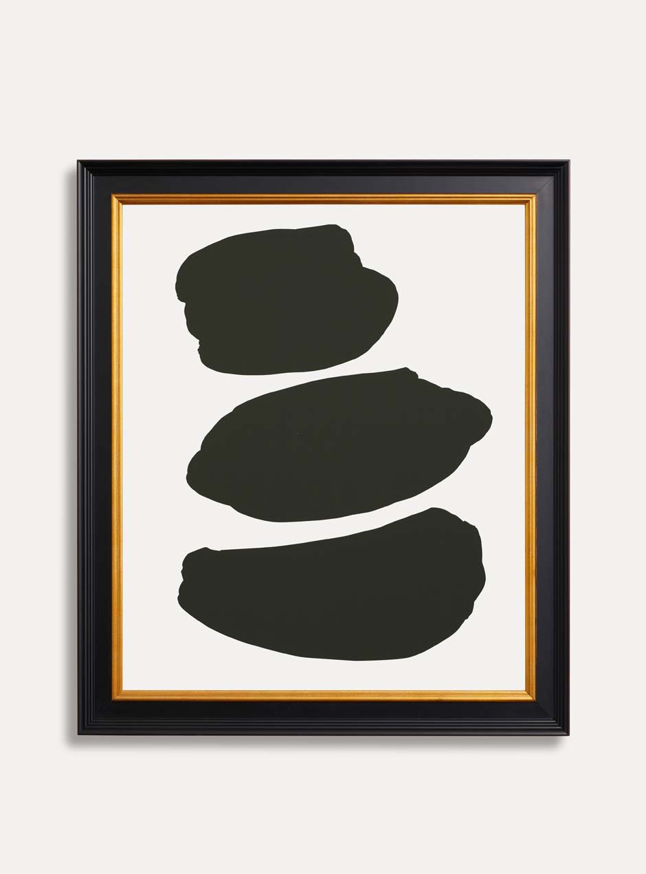 3 abstract black shapes on a white background in a black and gold frame