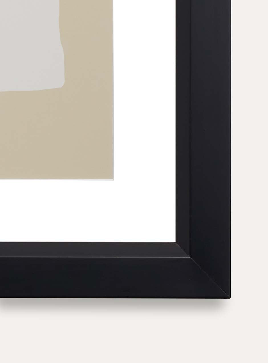 detailed photo black frame with slight bevel towards center showcasing brown and neutral artwork with white mat on a white wall