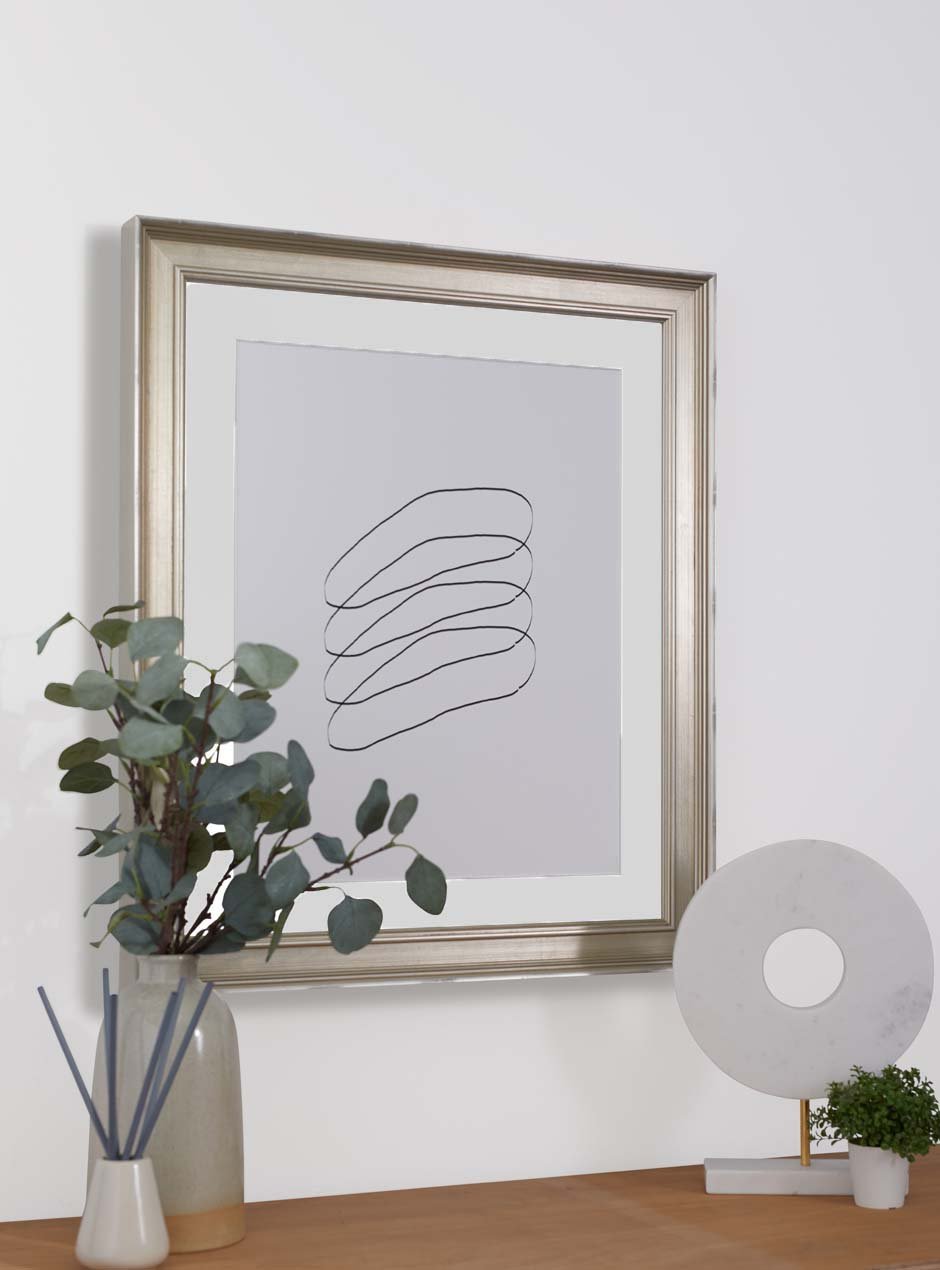 silver frame hung in home