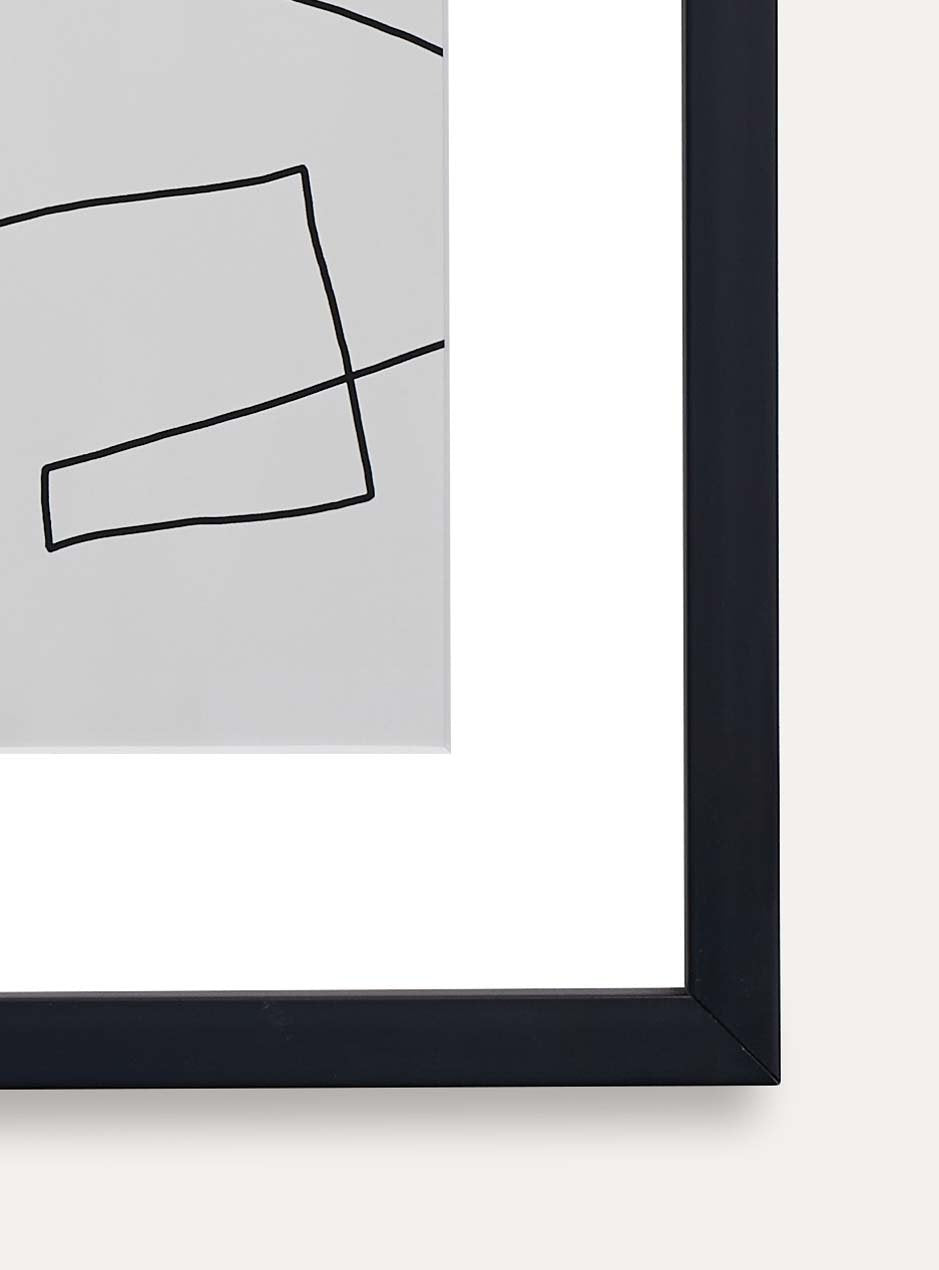 detailed photo showing thin modern black wood frame with white matboard and linear modern abstract artwork on a white wall