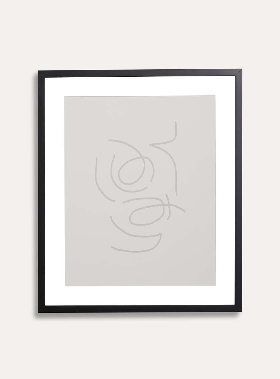 thin black frame holding abstract art