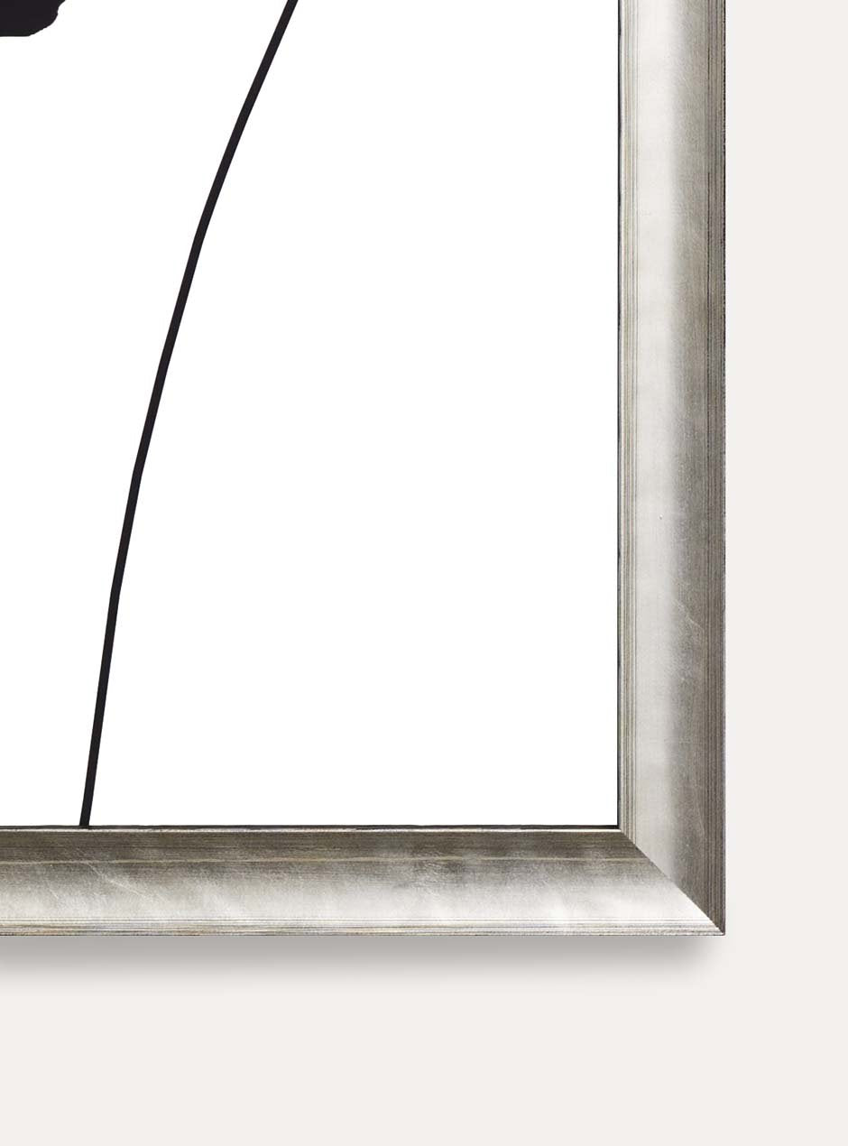 close up of corner of silver frame holding abstract flower art