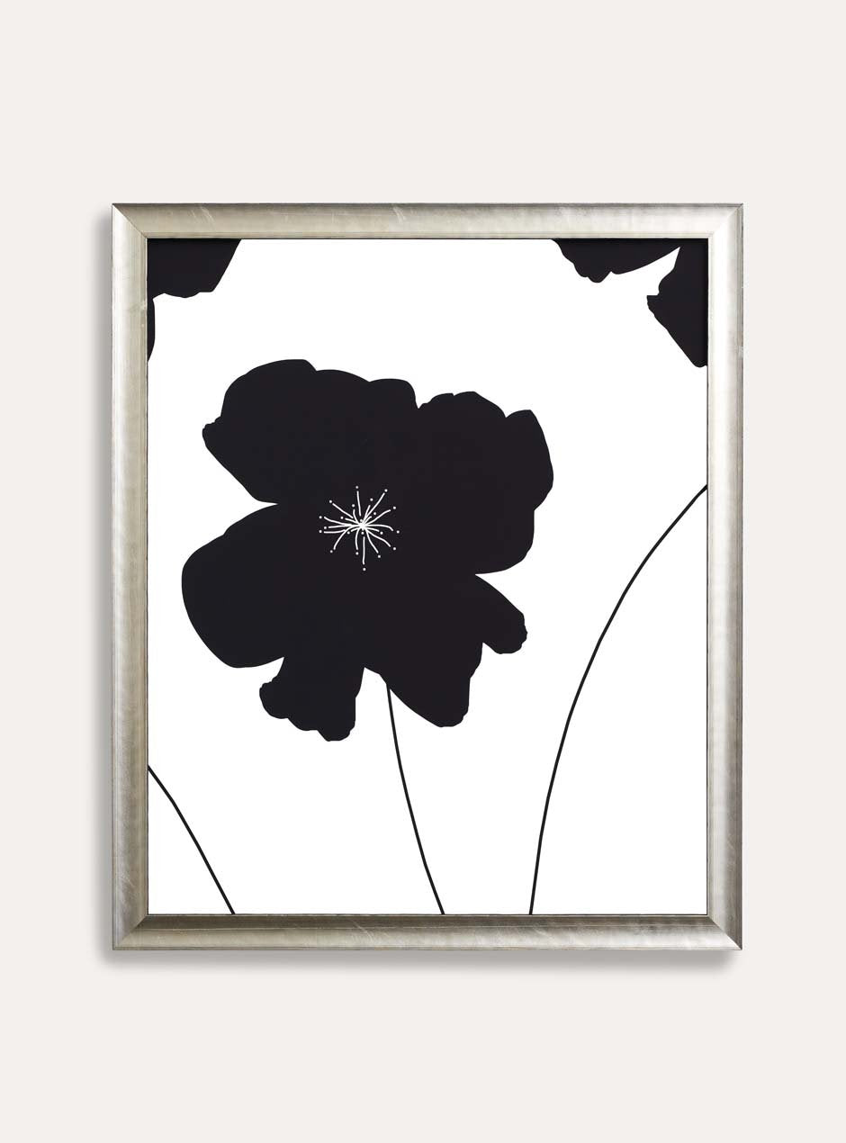 silver frame holding abstract flower art