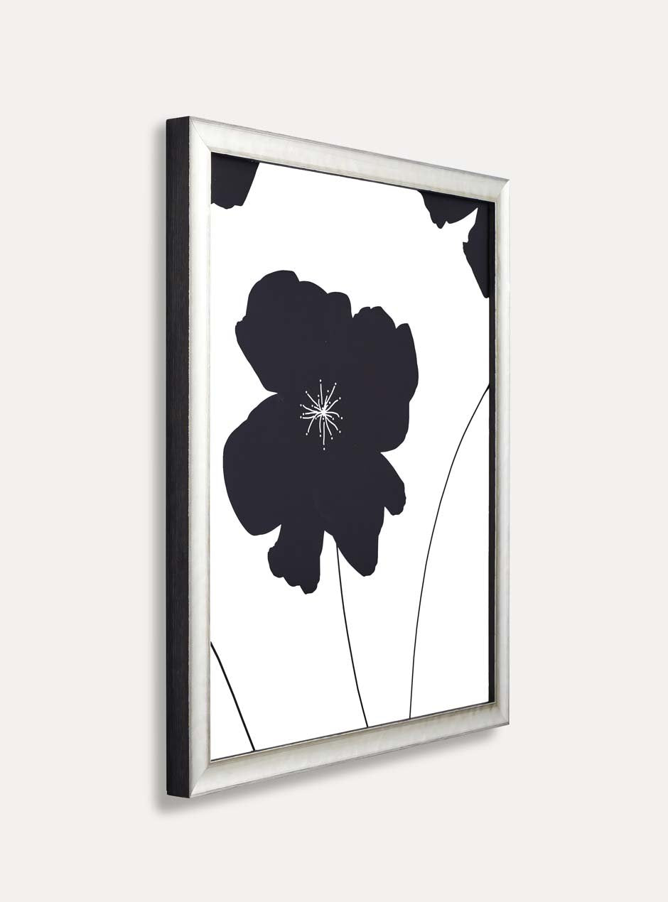 side view of silver frame holding abstract flower art