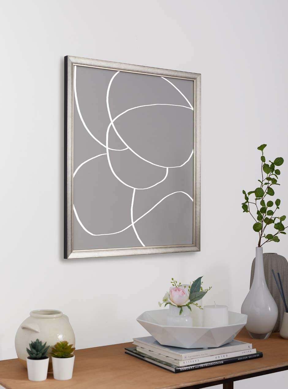 silver frame hung in home