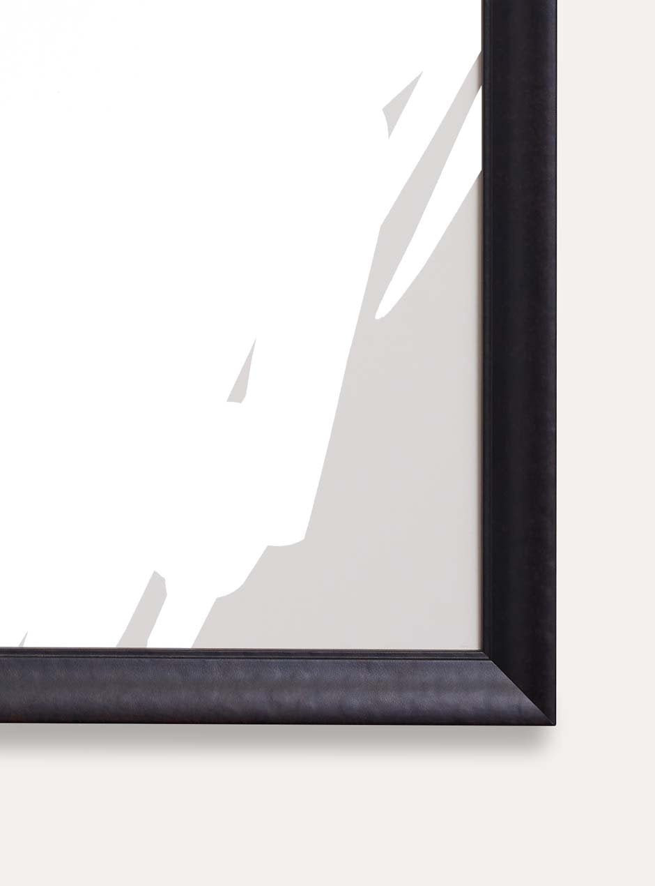 detailed photo of bottom right of black textured picture frame with pitched down moulding style with abstract neutral artwork