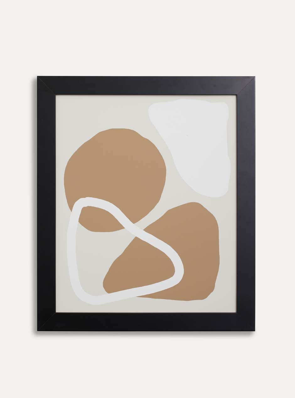 black skyframe wide frame called agbes with neutral tone abstract artwork inside hanging on plain wall modern style