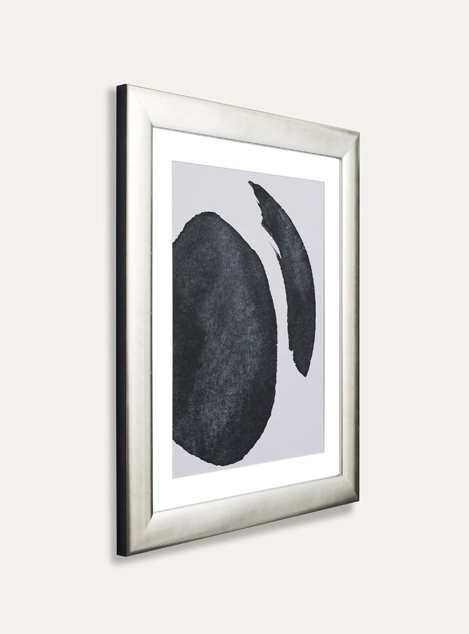 side view silver frame holding abstract black and white painting 