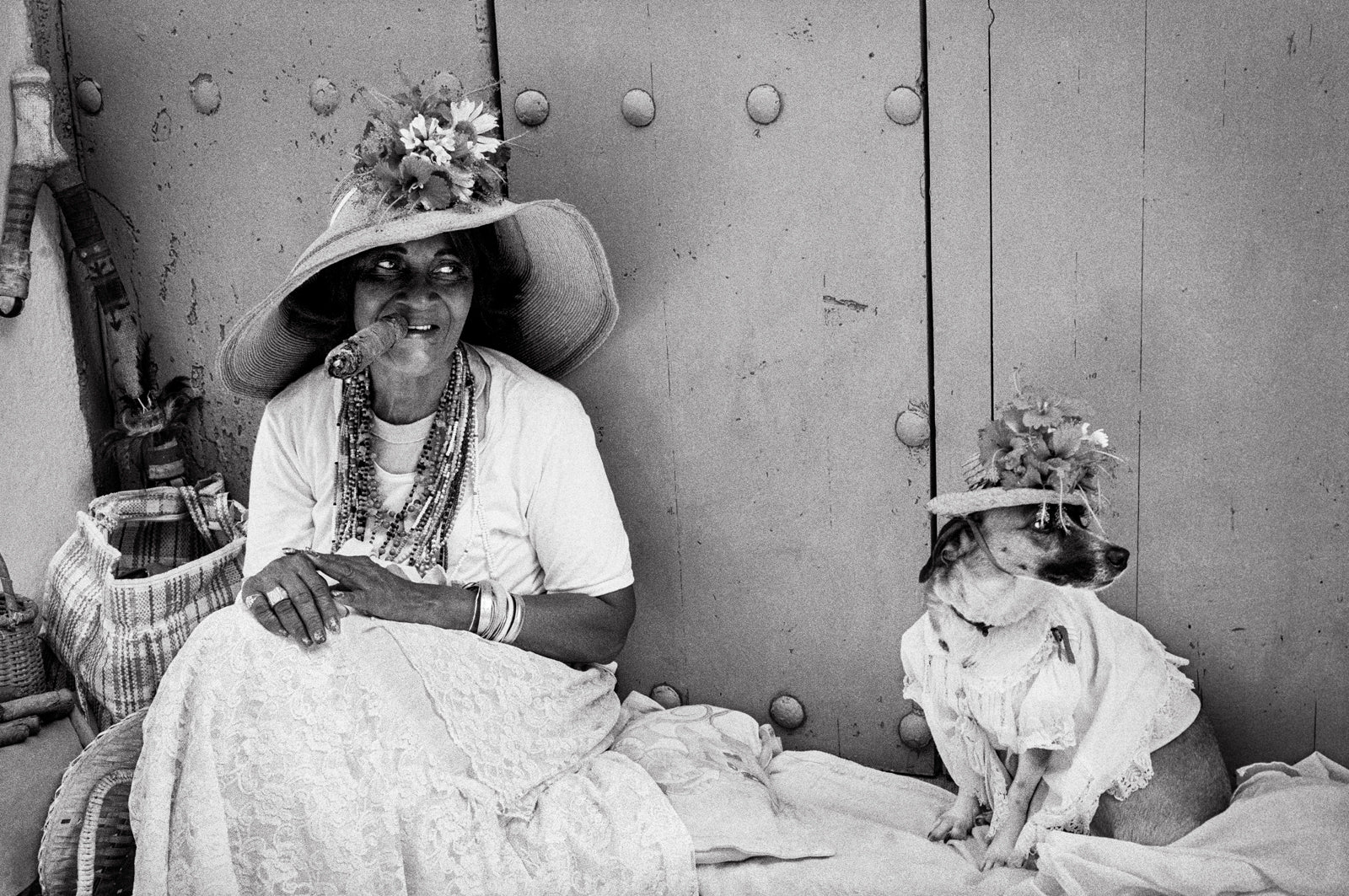 woman and dog in matching hat black and white photograph 
